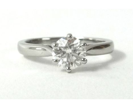 A fine diamond solitaire, with GEM certificate indicating weight 1.01cts, colour 6 (I), clarity VS1, round brilliant cut, set