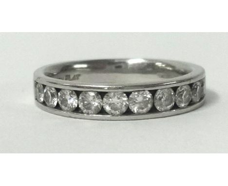 A platinum half band diamond eternity ring, set with 10 round cut diamonds, if similar design to Lot 151.