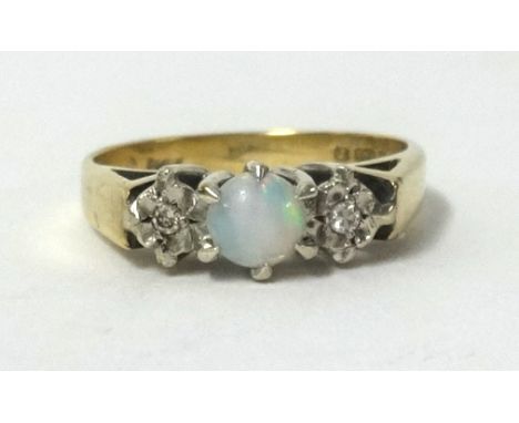 A 9ct opal and diamond 3 stone ring, finger size K.