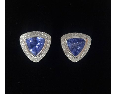 A pair of 14k white gold and diamond earrings set with trillion cut tanzanite's approx 1.21ct total weight, diamonds approx 0