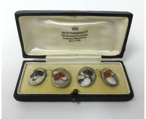 A pair of enamel and silver 'dog' cufflinks, boxed.