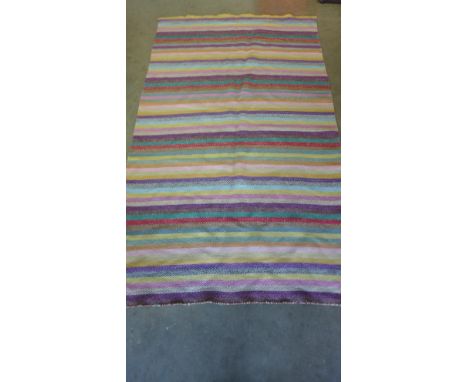 A contemporary herringbone pattern woven rug by Linie Design for Heals in the caravan range - 195cm x 115cm - very light wear