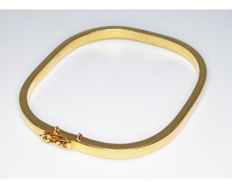 A rectangle section bangle, marked '750', wt. 11.8g.  