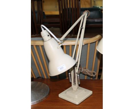 A Herbert Terry and Sons cream Angle-poise lamp with bakelite crabtree switch.  