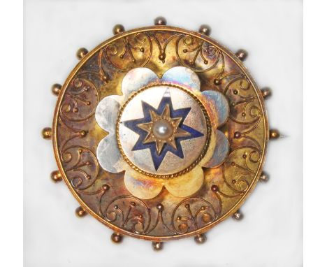 A Victorian gilt metal target brooch, set with a central pearl within blue enamel star, diameter 35mm.  