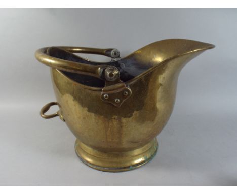 A Brass Helmet Shape Coal Scuttle.
