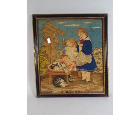A Framed 19th Century Tapestry Depicting Children with Rabbits.