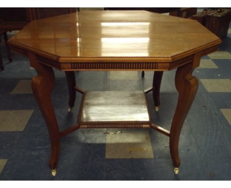 An Edwardian Octagonal Centre Table with Stretcher Shelf.