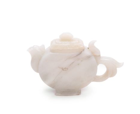 Chinese carved jade tea pot with Phoenix style  spout. 15.9oz H:4.25in(10.7cm) W:6.75in(17.1cm)