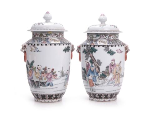 Pair of Chinese famille rose beast handle lidded  jars. Decorated with Daoist emblems a depicting scholars showing a scroll a