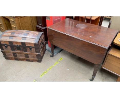 A Victorian mahogany Pembroke table, the rectangular top with drop flaps on reeded legs together with a banded trunk
