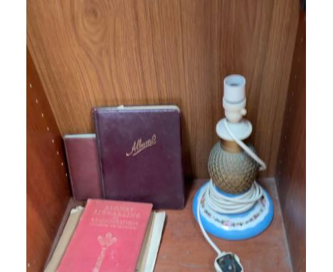 A porcelain table lamp together with schoolboy Autograph albums etc