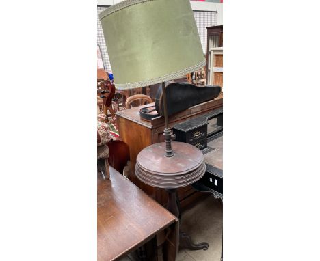 A Victorian mahogany converted standard lamp, with a circular platform and two lidded compartments on a turned column and tri