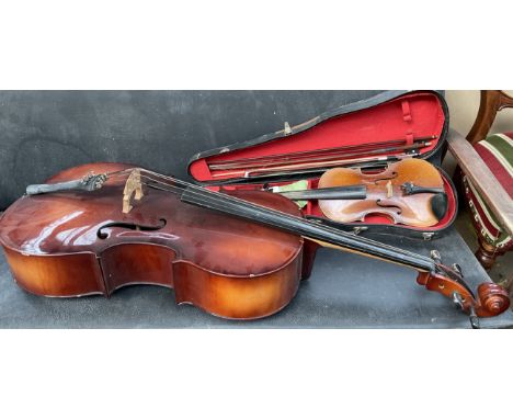 An Artia cello together with a violin with one piece back, 35.5cm long not including button, bears a label for Antonius Strad