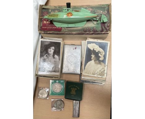 A Sutcliffe model of Nautilus, boxed together with a cigarette case, assorted postcards, commemorative crowns etc