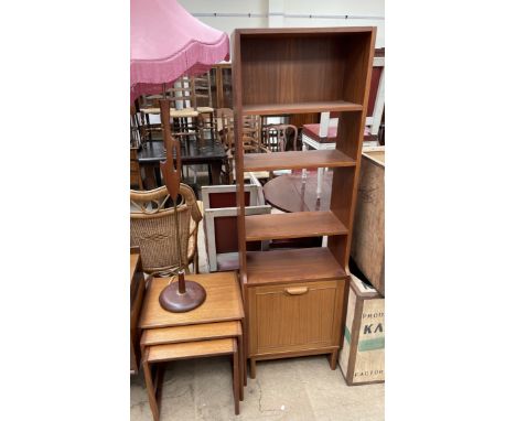 A G-Plan teak nest of three tables together with a teak and brass standard lamp and a Stateroom bookcase