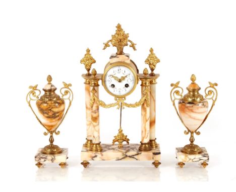 An ormolu and marble clock garniture, the enamel dial and eight day movement in drum shaped case supported on columns with fo