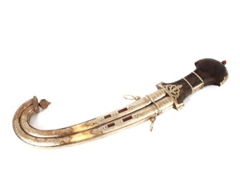 A Khanja Jambyo, Indian sword in white metal, wood and horn mounted scabbard