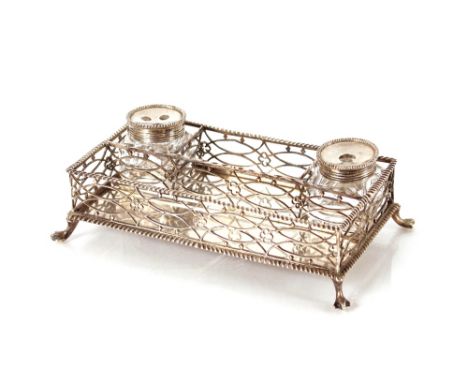 An early 19th Century plated inkstand,&nbsp;in the Chippendale manner having pierced fret work body, glass bottles and slide 