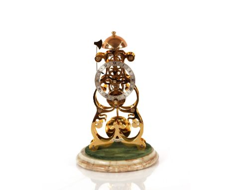 A brass skeleton clock,&nbsp;by Thwaites &amp; Reed Ltd, under glass dome and set on onyx base, striking on a bell 29cm high&