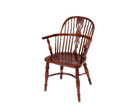 An early 19th Century yew wood and elm stick back Windsor chair,&nbsp;having shaped seat raised on crinoline stretcher AF