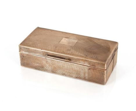 A silver cased and wood lined cigarette&nbsp;box,&nbsp;with engine turned decoration, London 1926, 19cm long