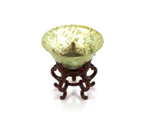 A green jade bowl, 10cm dia. on carved hardwood stand