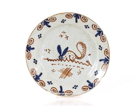 A rare early 18th Century English Delftware dish,&nbsp;painted with a stylised hare with a squirrels tail, birds flying overh