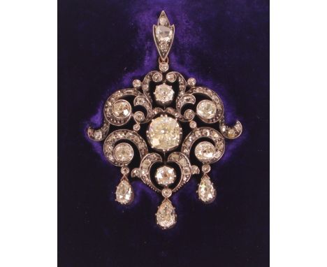A diamond pendant, having yellow metal and white metal mounts set with approx. 1½ carat centre stone surround with an arrange