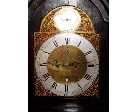 A George III and later marquetry inlaid mahogany long case clock,&nbsp;the domed hood with three brass finials above a centra