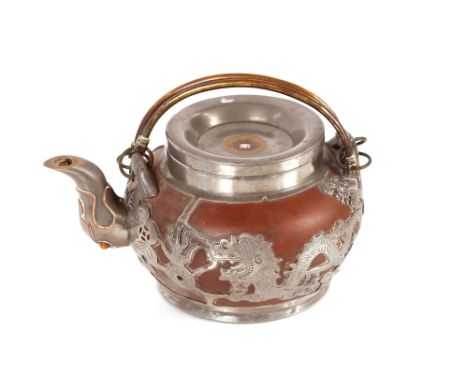 A Chinese Yixing red pottery pewter and brass mounted teapot,&nbsp;having dragon decoration with swing handle&nbsp;