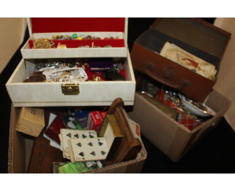 A jewellery box and contents of costume jewellery to include necklaces, brooches, together with two boxes of various items to