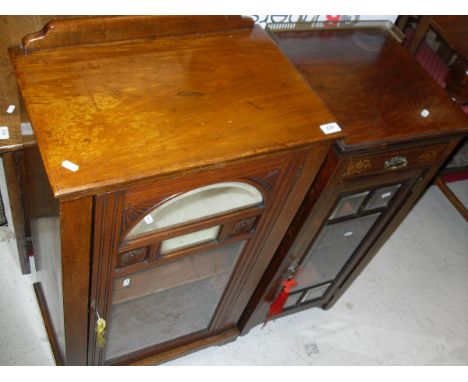 A Victorian mahogany music cabinet, the plain top with raised back above a glazed and mirrored door opening to reveal shelves