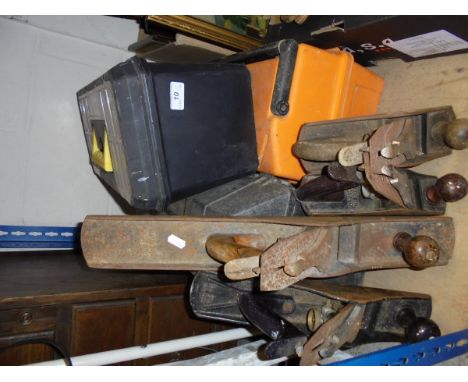 Three modern tool boxes containing various hand tools, together with four assorted planes