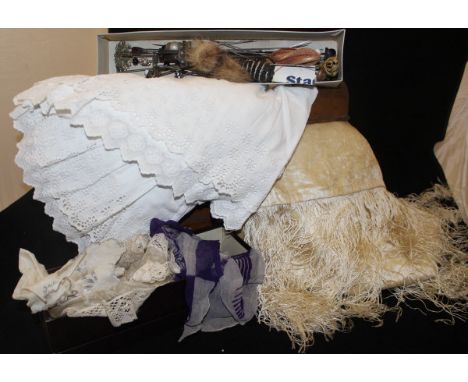 A tin trunk containing a cream velvet shawl, a box of vintage hat pins etc.