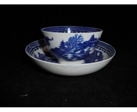 An 18th Century Caughley 'Fisherman with fish on a punt' tea bowl and saucer bearing Salopian 'S' mark to base CONDITION REPO