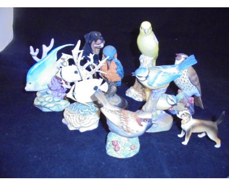 A Royal Worcester figure 3574 "Blue Angel" and three 573 "Four eyed fish" together with Beswick style figure "The Hound", a R