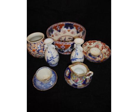 A collection of Chinese and Japanese china wares to include a pair of blue and white prunus blossom decorated vases with elep