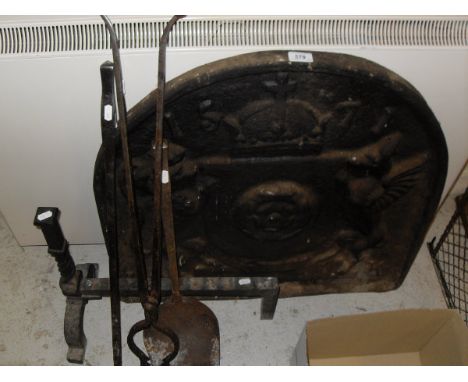 A cast iron fire back bearing date 1571, together with fire basket, wrought iron dogs and fire tools including two Cotswold s