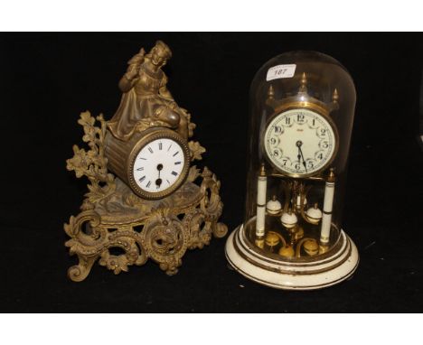 A modern Kundo glass domed clock with Arabic numerals to the enamelled dial, together with a brass cased mantle clock in the 