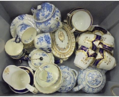 A collection of 19th Century and other English tea wares to include a New Hall type silver shaped sugar box and cover, a Bist