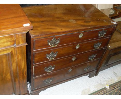 A late George III mahogany square front chest of drawers, the plain top above four graduated drawers with brass escutcheons a