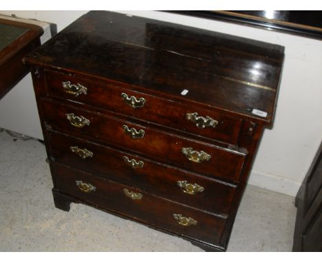 An 18th Century walnut bachelor's chest, the plain top above four graduated drawers with brass escutcheons and swan neck hand