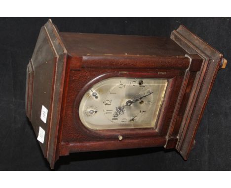 A circa 1900 mahogany cased mantle clock, the German musical movement with silvered dial and Arabic numerals
