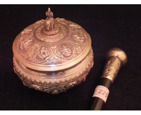 A white metal mounted ebonised walking cane, the finial set with Oriental symbols and three-clawed dragon motif, together wit