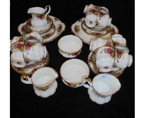 A Royal Albert "Country Roses" part tea set comprising twelve cups and saucers, two jugs, tea plates, sandwich plate, two sug