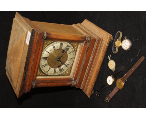 An oak cased mantle clock with Roman numerals to the brushed steel chapter ring with brass dial, together with a bag containi