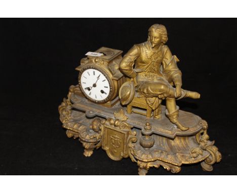 A French brass mantle clock in the form of a resting gentleman, his hat in hand, leaning against a clock face with Roman nume