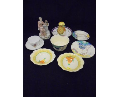 A Clarice Cliff "Bizarre" bowl, saucer, two plates, two Wilkinson pottery floral decorated dishes and a Grays pottery sugar c