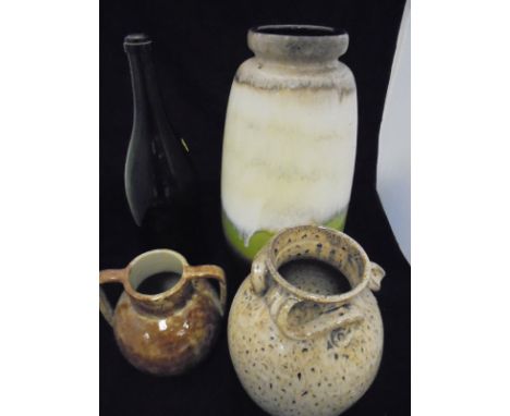 A large Western Germany pottery vase, a Hurlingham vase and an M Edwards Devon vase and a large green glass wine bottle